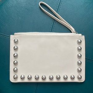 Off-white wristlet by Mango with silver studs and zipper